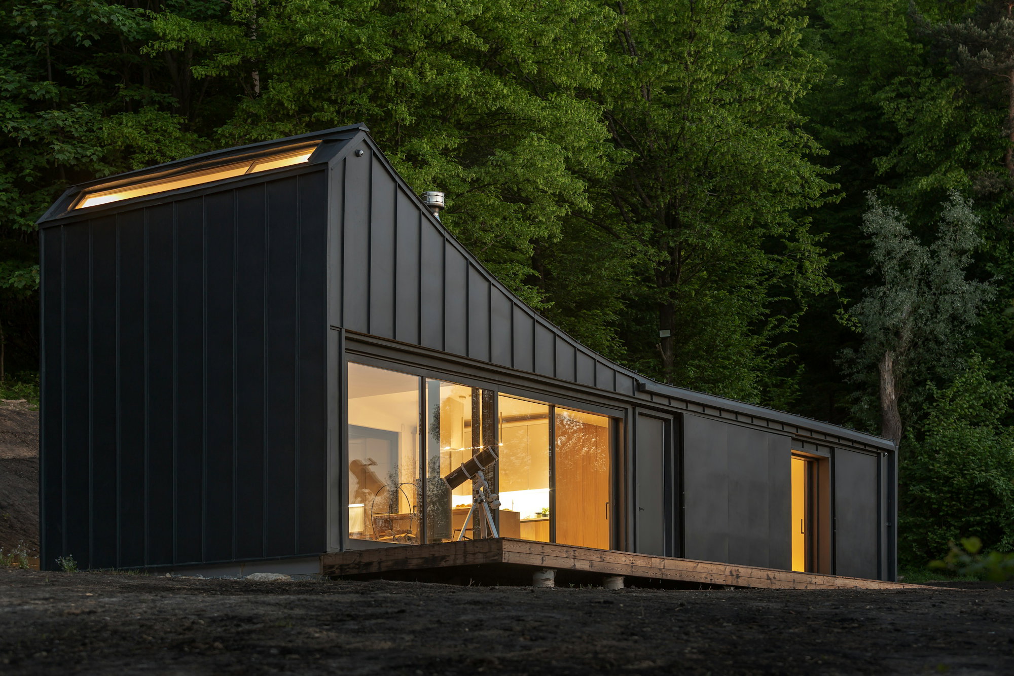 black-metal-trailer-house-near-green-trees.jpg black metal trailer house near green trees