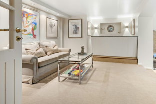 A living room filled with furniture and a fire place